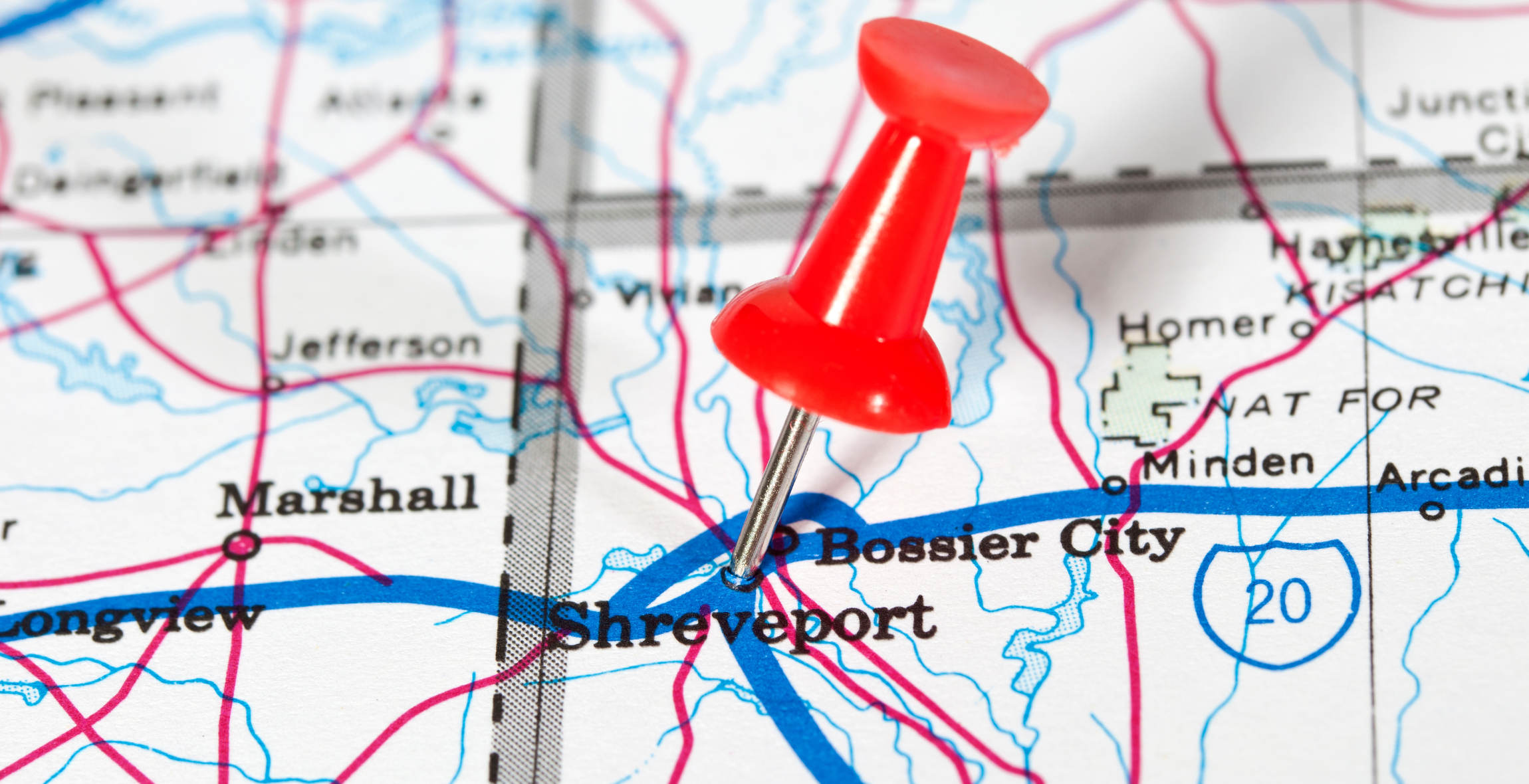 Pushpin marking Shreveport on a map of Louisiana