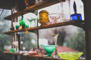 antiques on a shelf at an antique shop
