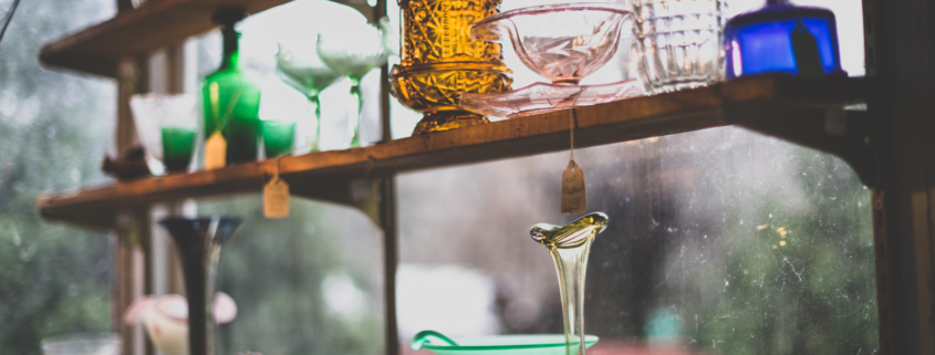 antiques on a shelf at an antique shop