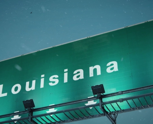 a green sign that says louisiana